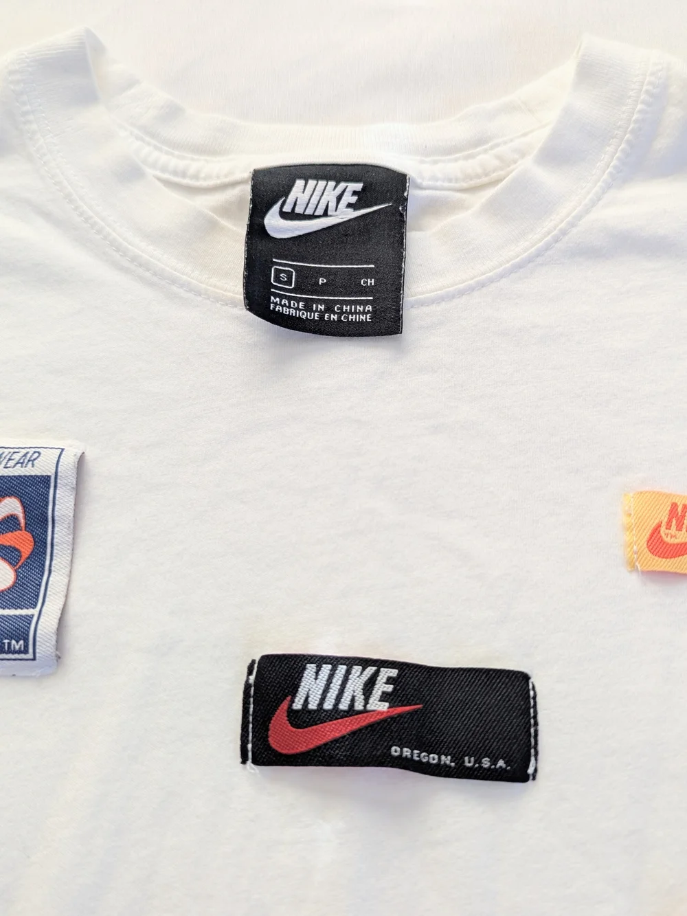 Nike White Long Sleeve Tee with Black and Red Logo Patches